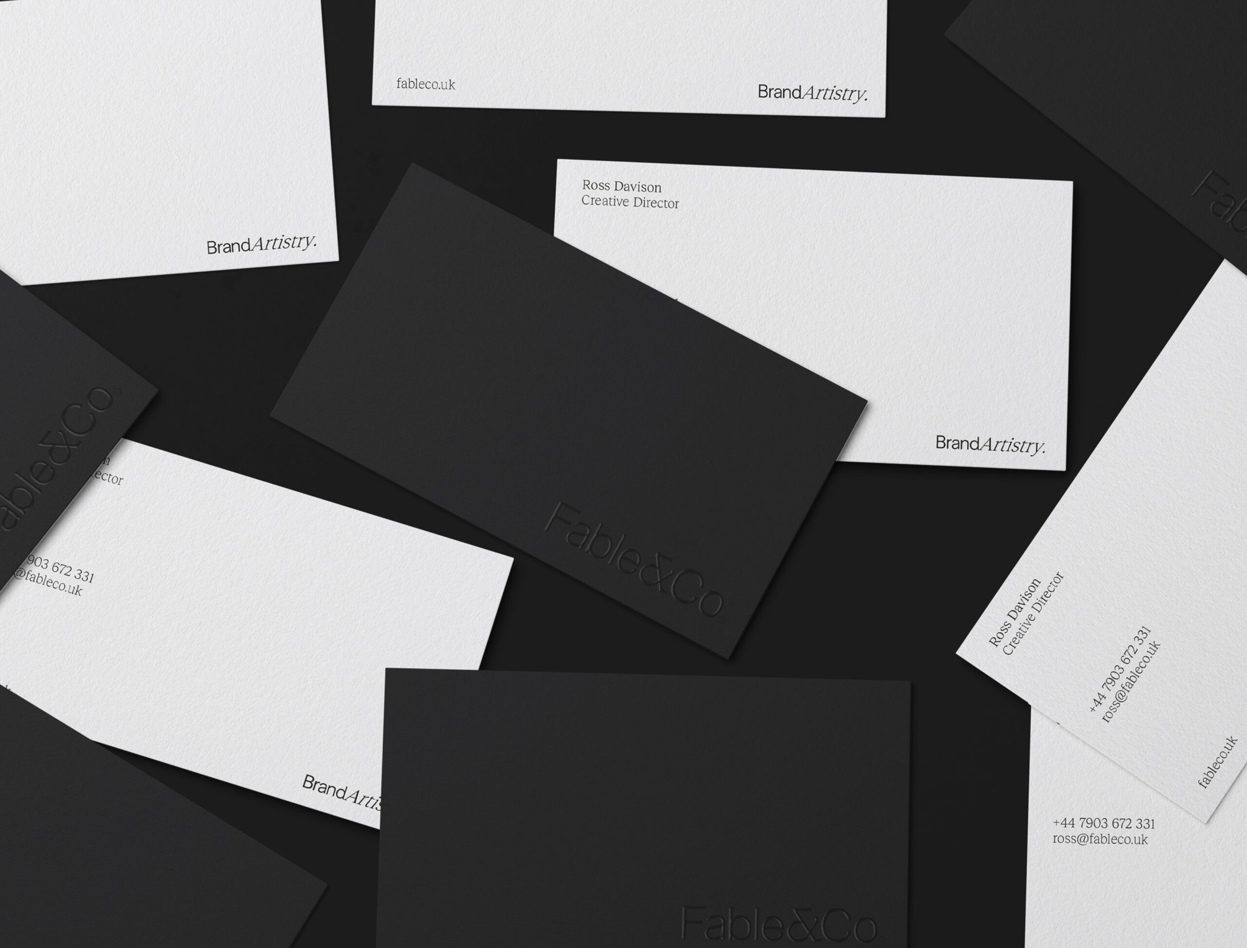 Minimalist black and white business cards for Fable&Co, featuring clean typography, embossed logo, and contact details with a modern, elegant design.